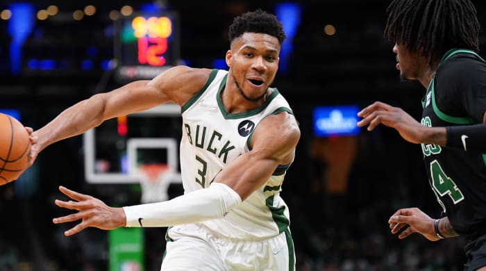 Milwaukee Bucks forward Giannis Antetokounmpo (34) passes the ball against Boston Celtics center Robert Williams III (44) in the second half during game one of the second round